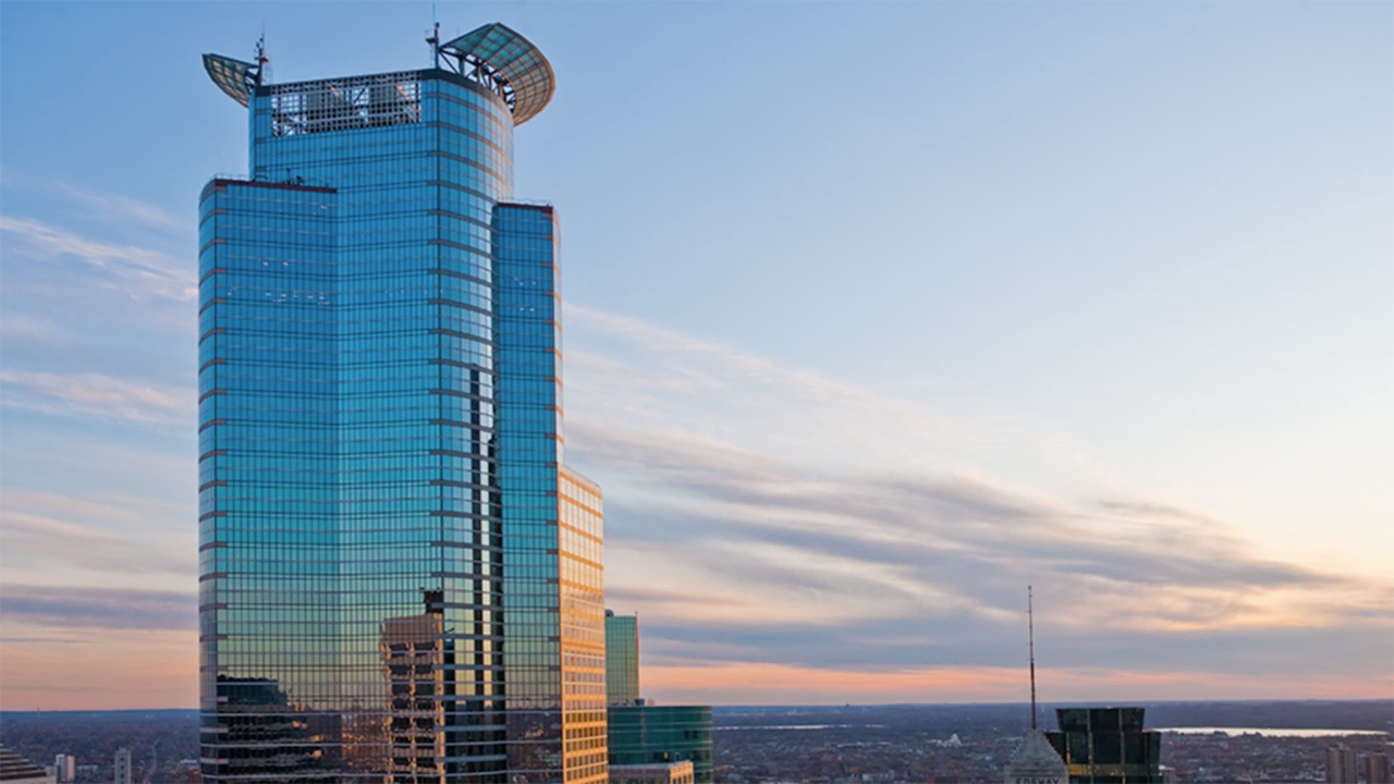 View of the Capella tower in Minneapolis with the sun setting in the background.